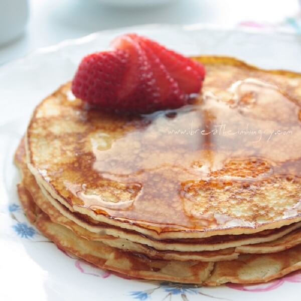 keto cream cheese pancakes with sugar-free syrup and strawberries