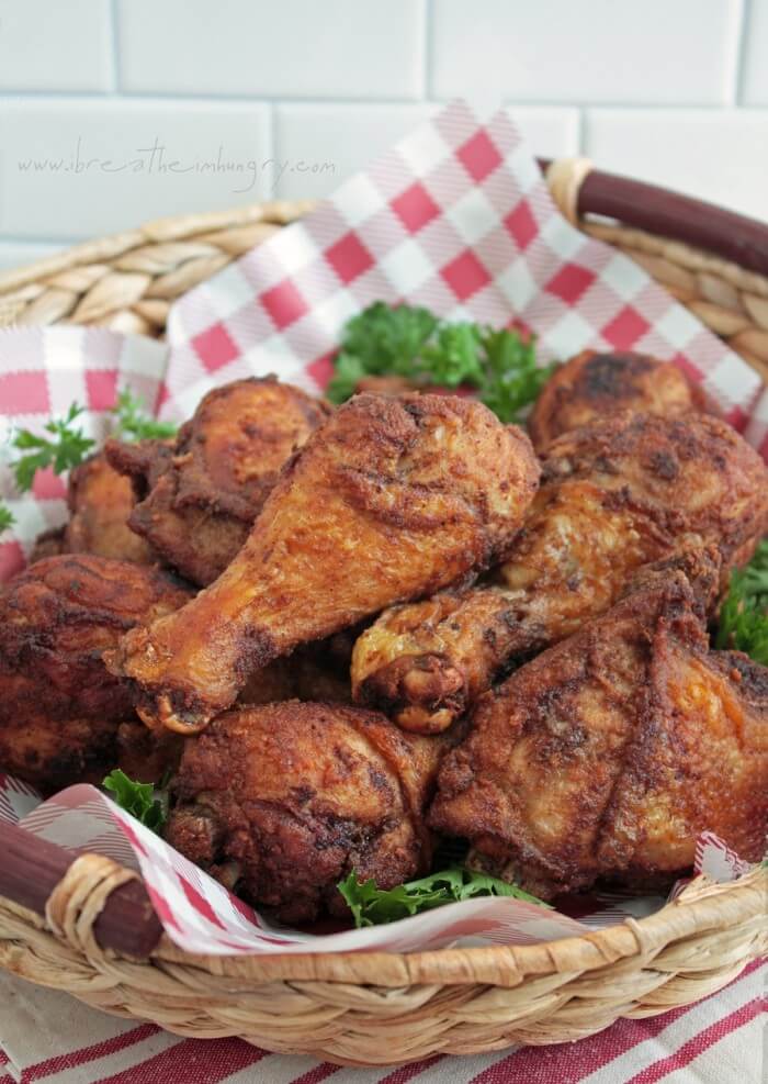 keto southern fried chicken in a basket with a red and white checked parchment paper liner