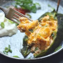 Keto Cheese Chicken Stuffed Poblanos with a forkful showing in the foreground