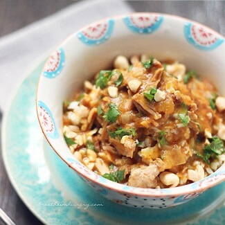 Keto Pumpkin, Pork and Peanut Stew garnished with cilantro and chopped peanuts