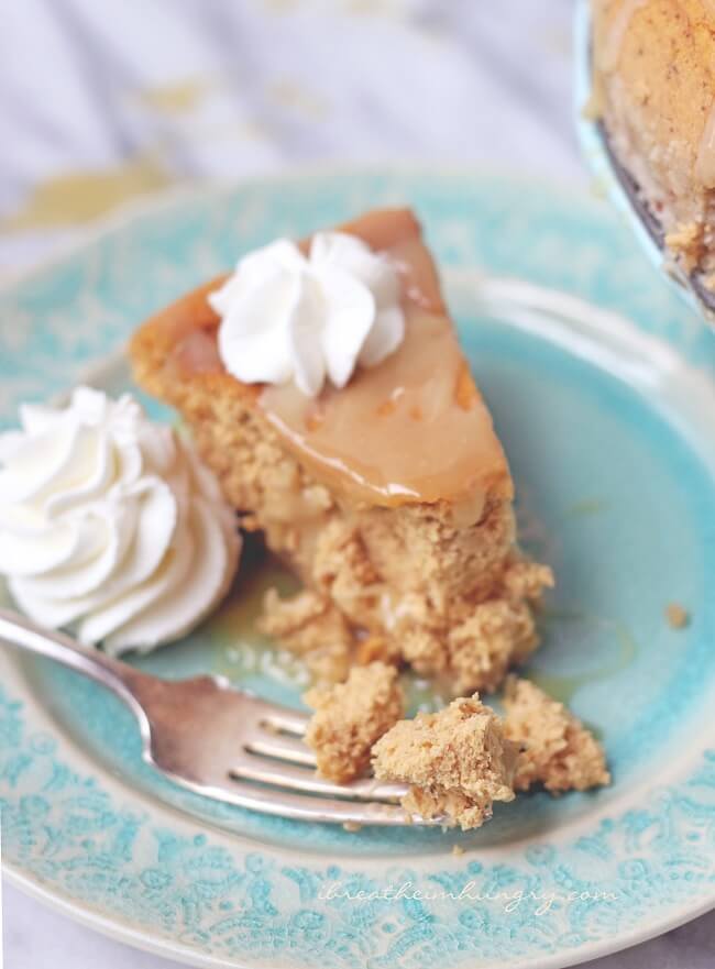 Keto Pumpkin Caramel cheesecake slice on a light blue plate