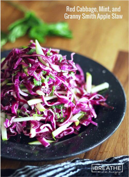 This Low Carb Red Cabbage, Mint, and Granny Smith Apple Slaw is not only gorgeous, it's also cheap, easy, super healthy for you, and tastes amazing! ibreathimhungry.com