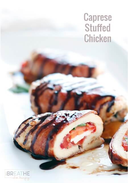 Cross section of a stuffed chicken breast on a white plate