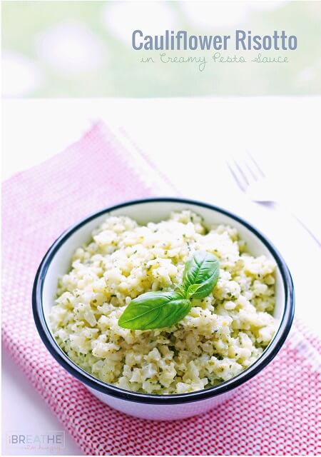 This versatile low carb side dish recipe perfectly mimics a classic risotto but is made with cauliflower in a cheesy pesto sauce. Keto and Atkins friendly.