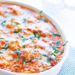 Cauliflower alla Vodka Casserole in a white baking dish with a blue background