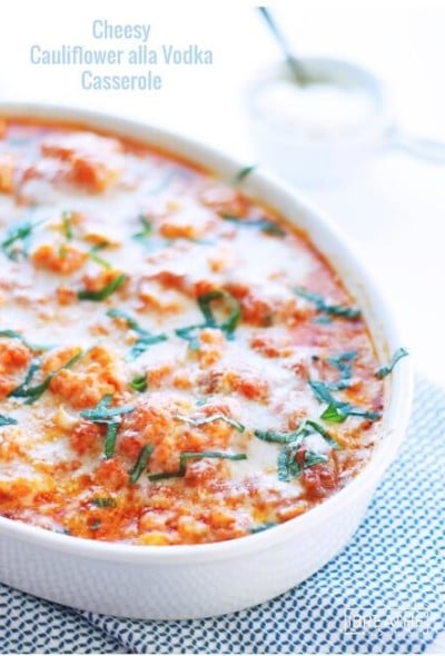 Cauliflower alla Vodka Casserole in a white baking dish with a blue background