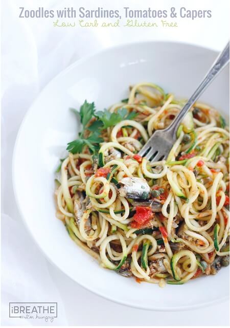 This low carb zucchini recipe contains super healthy sardines, garlic, tomatoes, capers and fresh herbs. Easy and delicious, it's also Paleo and Whole 30 approved!!