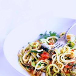 This low carb zucchini recipe contains super healthy sardines, garlic, tomatoes, capers and fresh herbs. Easy and delicious, it's also Paleo and Whole 30 approved!!