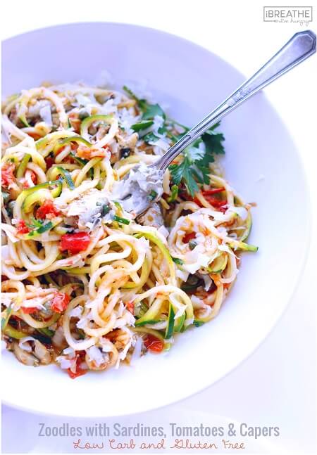 This low carb zucchini recipe contains super healthy sardines, garlic, tomatoes, capers and fresh herbs. Easy and delicious, it's also Paleo and Whole 30 approved!!