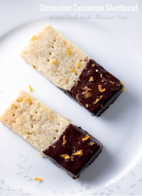 These delectable low carb shortbread cookies are flavored with cardamom and clementine zest, then dipped in dark chocolate! Gluten free too!