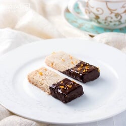 These delectable low carb shortbread cookies from Mellissa Sevigny from I Breathe Im Hungry are flavored with cardamom and clementine zest, then dipped in dark chocolate! Gluten free too!