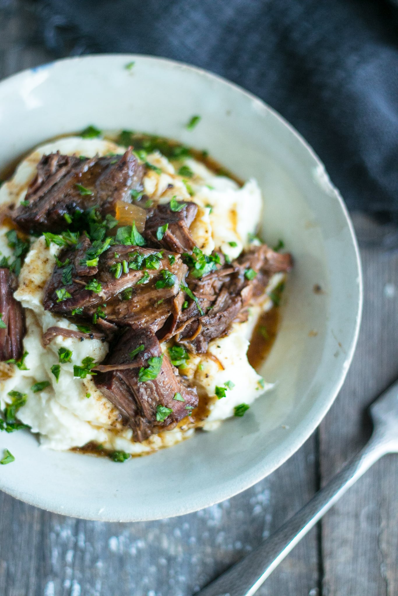 Keto Pot Roast in a white pottery bowl shot from above