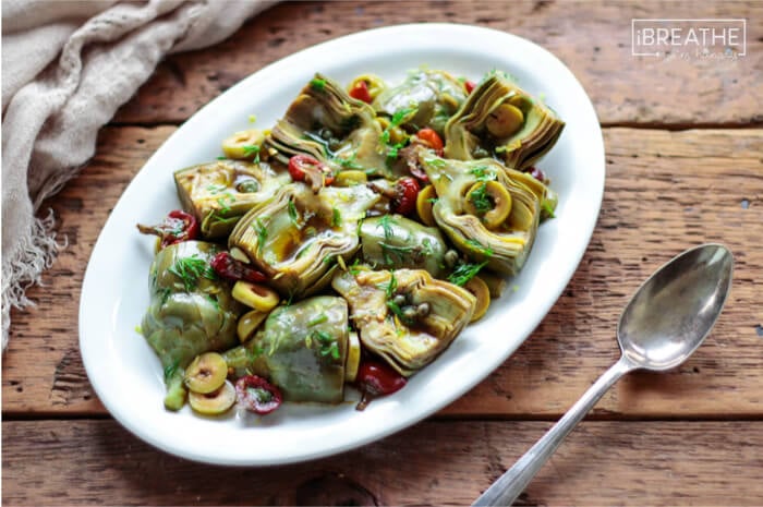 A delicious low carb and gluten free antipasto salad featuring marinated baby artichokes!