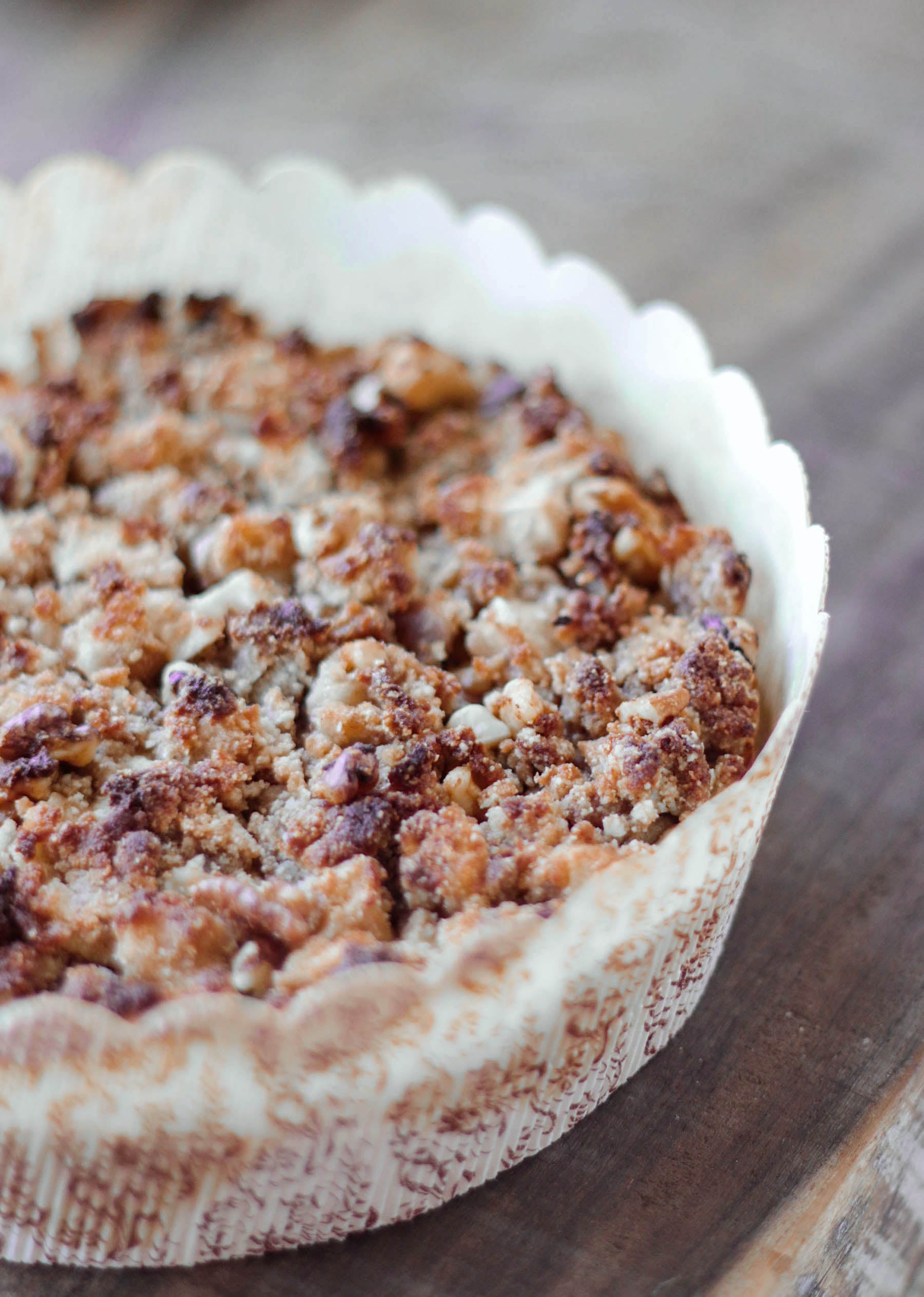 Low carb Apple Cake with streusel topping in a paper cake mold