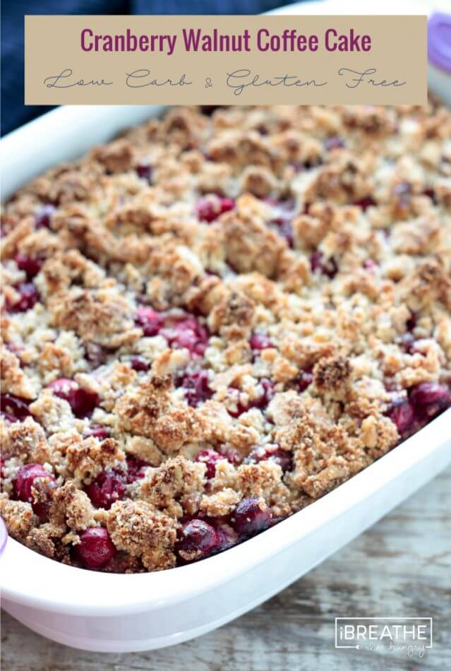 This low carb cranberry walnut coffee cake boasts a subtly orange flavored cake with a burst of tart cranberries & a toasty walnut streusel topping! Keto, Atkins, Gluten Free