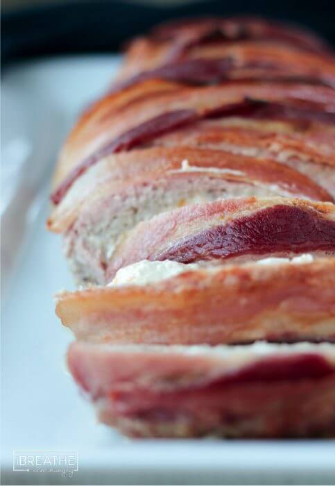 A delicious pork meatloaf stuffed with jalapeño popper filling and wrapped in bacon!