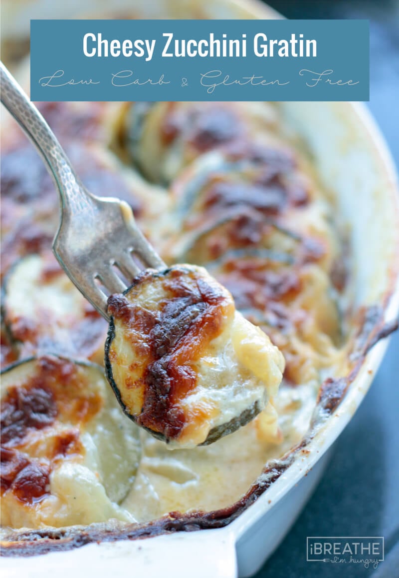 Cheesy Zucchini Gratin showing a forkful with toasted cheese and creamy filling