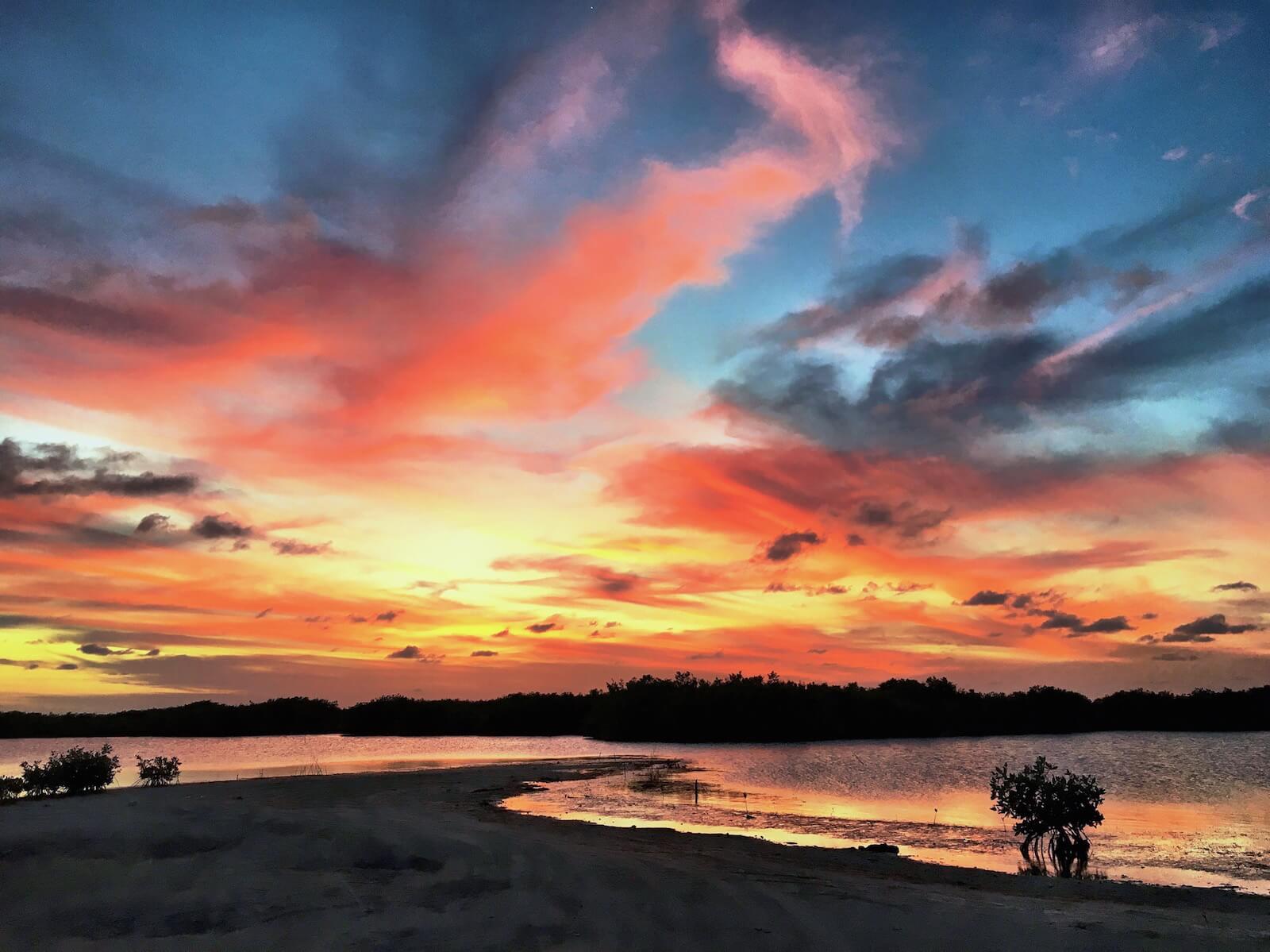 A gorgeous sunset near Mahogany Bay on Ambergris Caye by Mellissa Sevigny