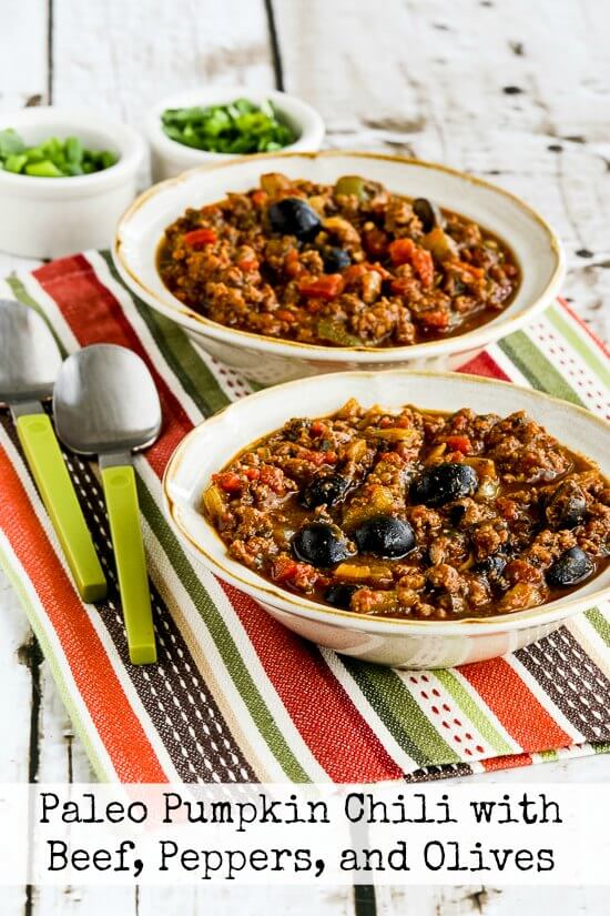 two bowls of low carb beefy pumpkin chili with black olives