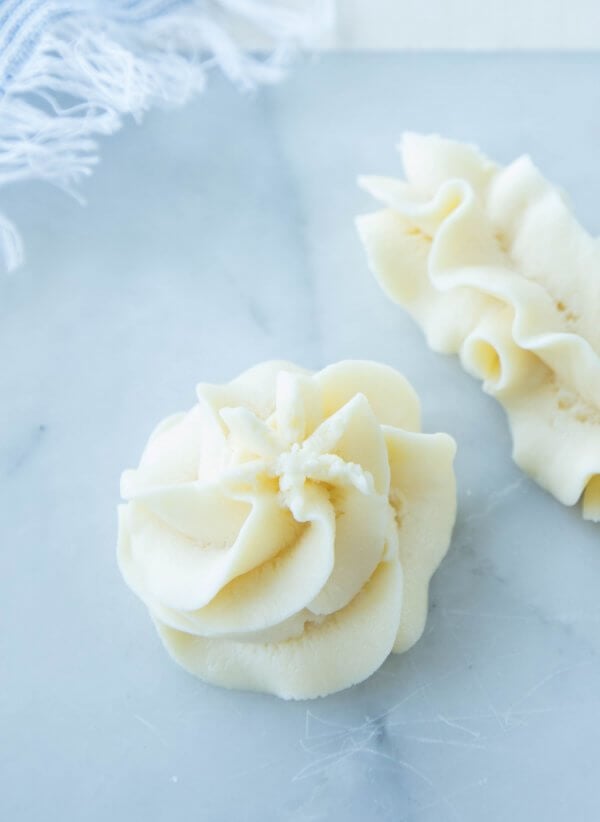 Keto Cream Cheese Frosting Swirled on Marble Board
