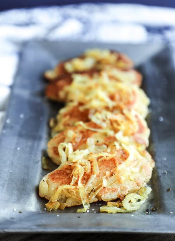 A low carb pierogi made with fathead dough on a pewter tray.