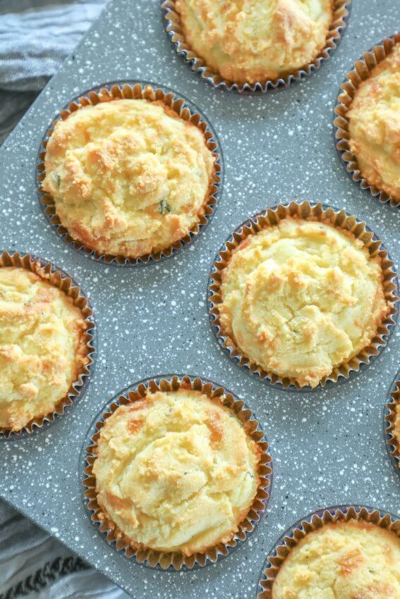 Keto Cheesy Herb Muffins in a grey muffin tin