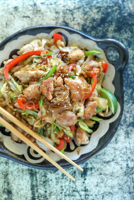 Keto Crispy Pork & Noodle Stir Fry on black and white plate