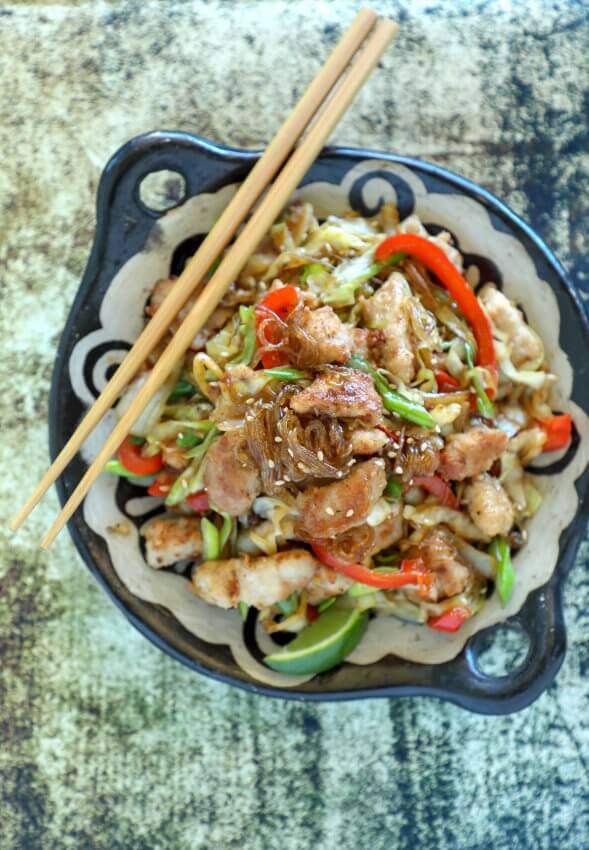 Keto Crispy Pork Noodle Stir Fry on green background