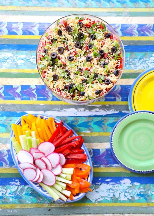 Top view of Keto 7 Layer Dip on Colorful tabletop