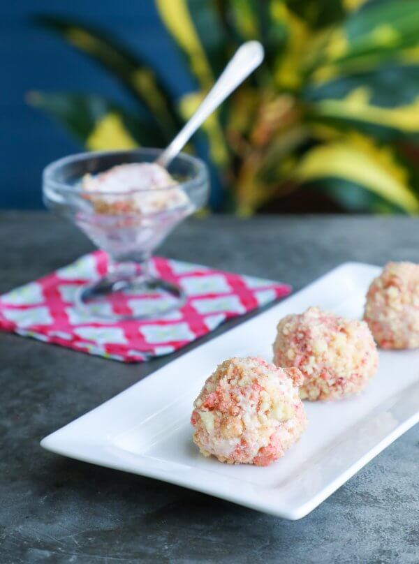 Keto Strawberry Shortcake Ice Cream Bon Bons on a grey background