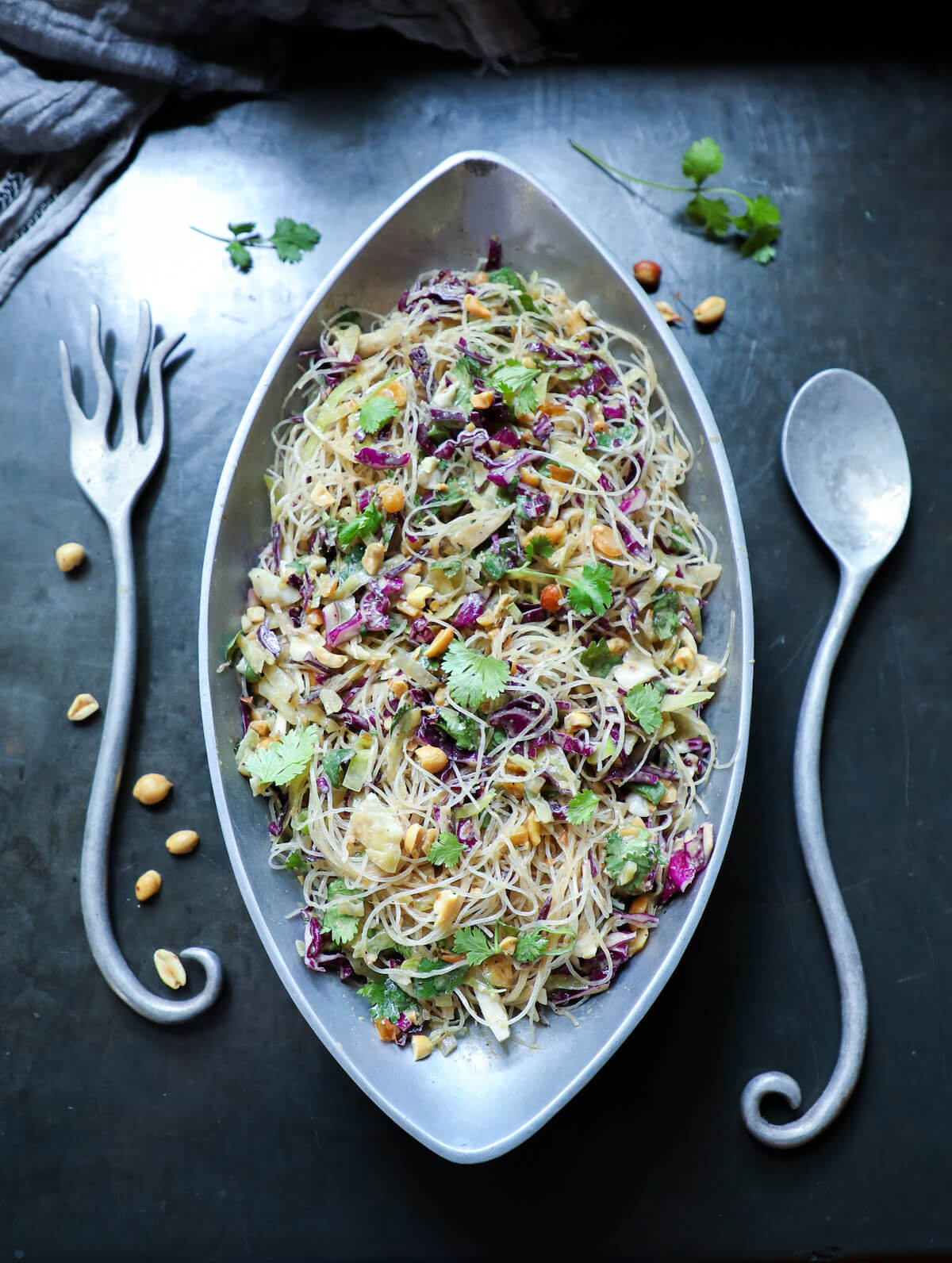 Keto Asian Noodle Salad with Peanut Sauce on black concrete background