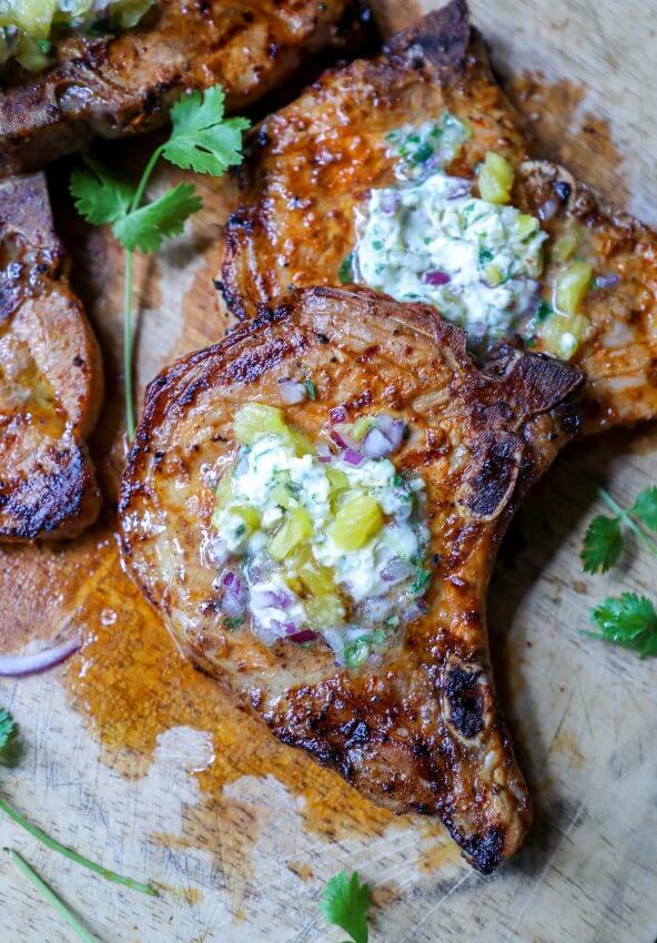 Keto Pork Chops al Pastor on a wooden cutting board