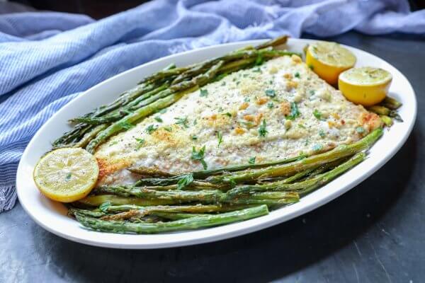 Keto Sheet Pan Salmon and Asparagus on an oval platter side view
