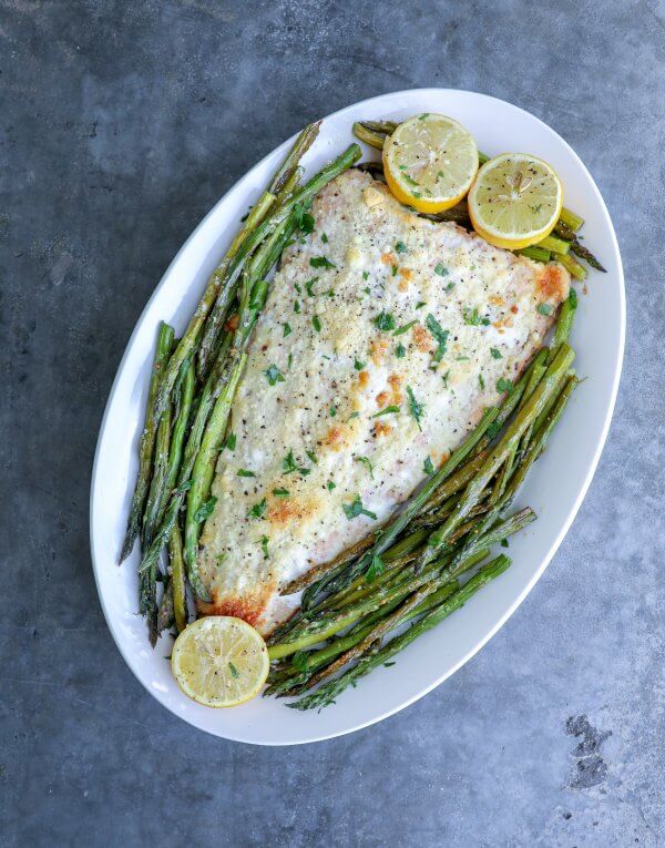Keto Sheet Pan Salmon & Asparagus on grey concrete background