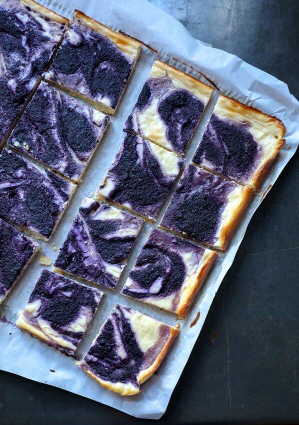Easy Keto Blueberry Cheesecake Bars on black background