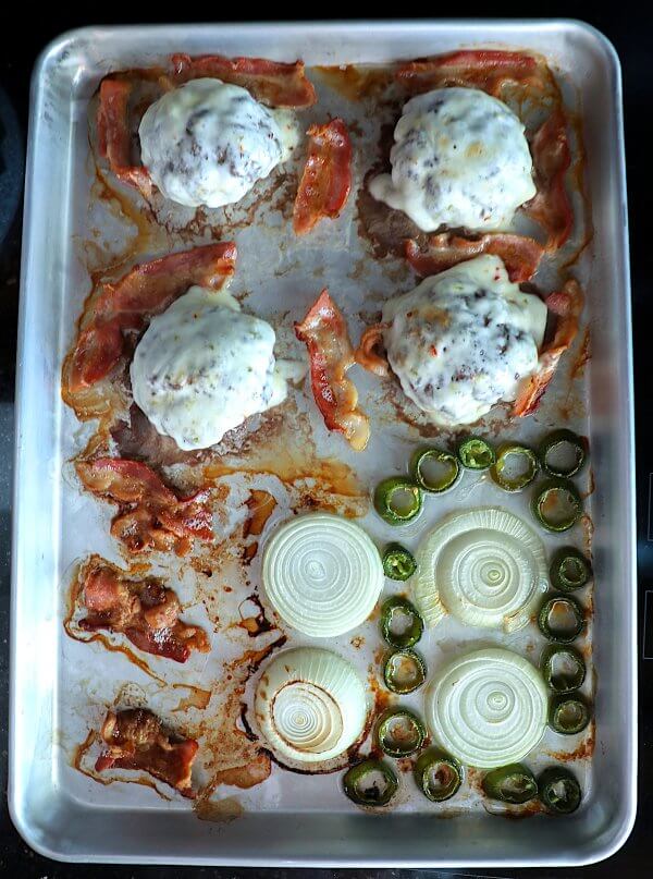 Keto Sheet Pan Burgers with Bacon & Jalapeño on the pan