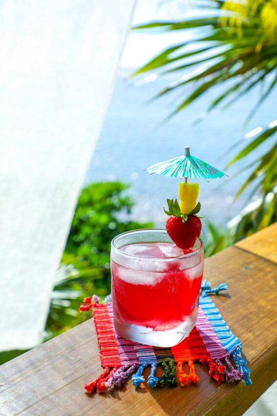 Easy Keto Rum Punch on rainbow coaster