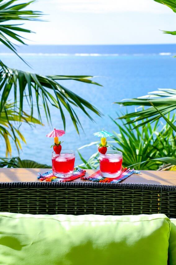 Easy Keto Rum Punch with lime green couch in foreground