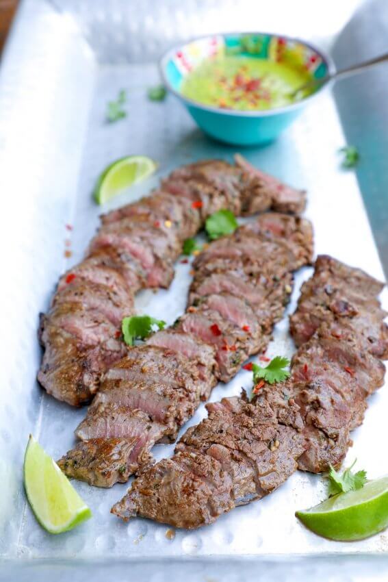 Keto Carne Asada with Chimichurri on a sliver platter