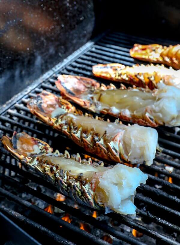 Keto Grilled Lobster Tails with Creole Butter on grill