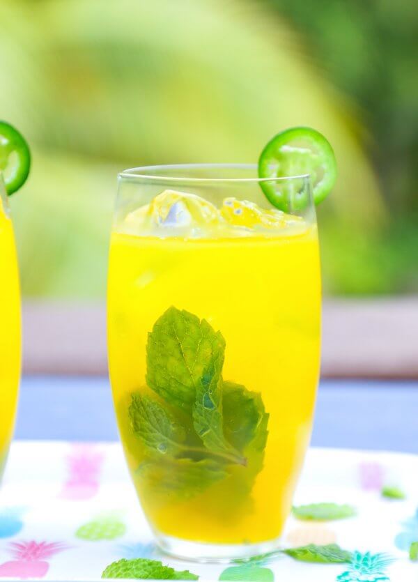 Keto Spicy Mango Mojitos with jalapeño and mint garnish