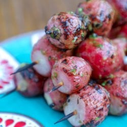 Keto Grilled Radish Skewers on turquoise plate