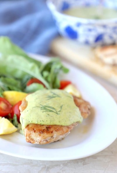 Keto Chicken & Creamy Dill Sauce on a white platter with salad