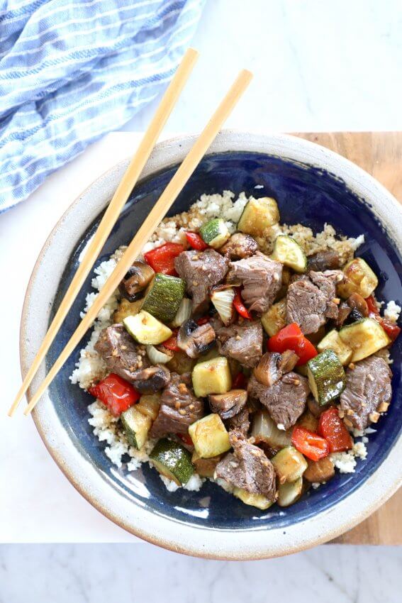 Keto Sheet Pan Hibachi Beef & Vegetables on a blue plate with chopsticks