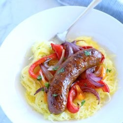 keto sheet pan sausage & peppers white bowl marble background