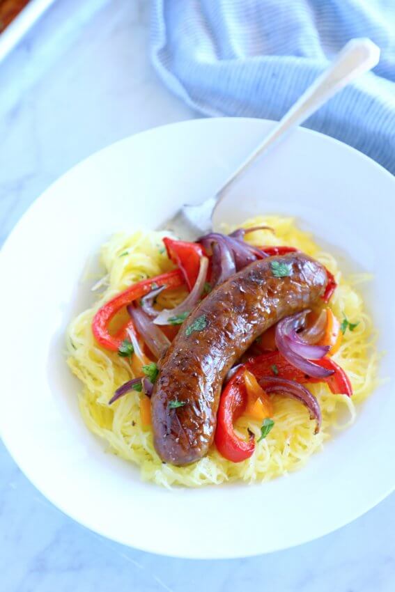keto sheet pan sausage & peppers white bowl marble background