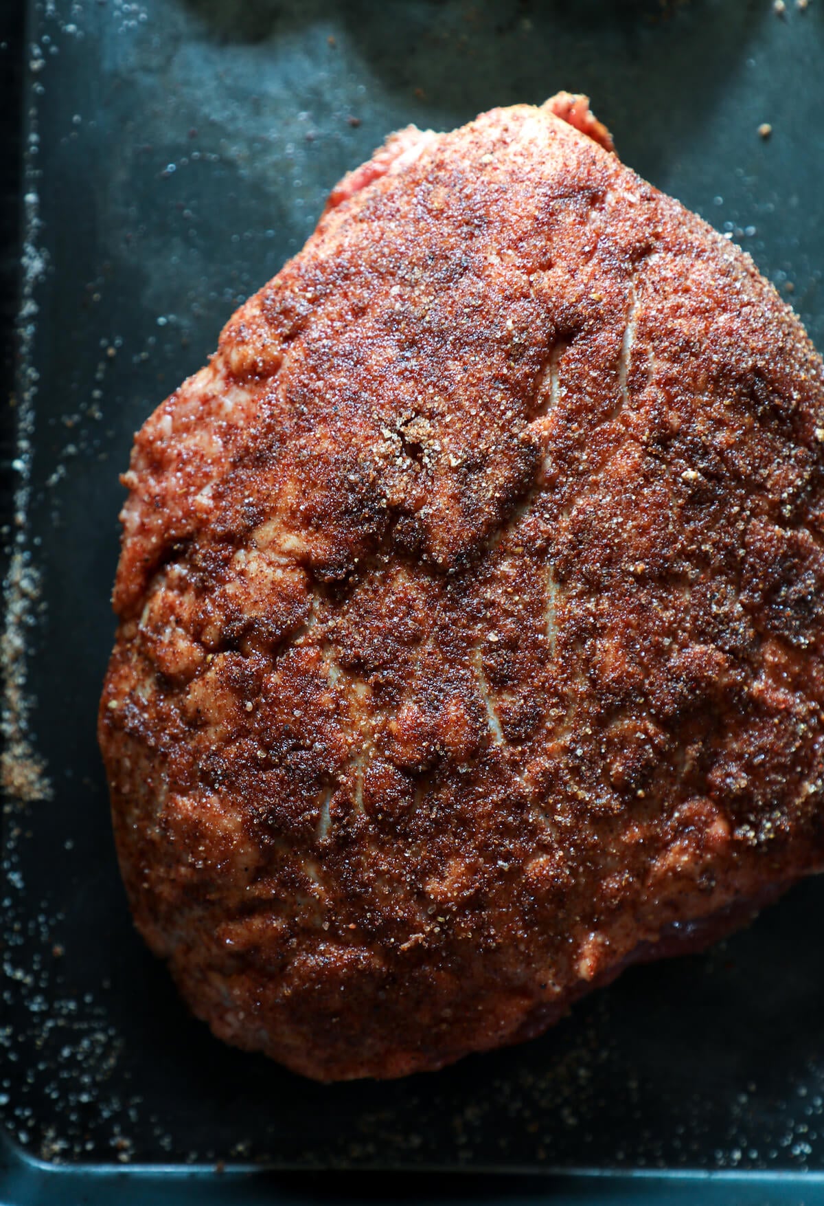 Keto Beef Brisket in the Instant Pot on a cookie sheet, seasoned but still raw