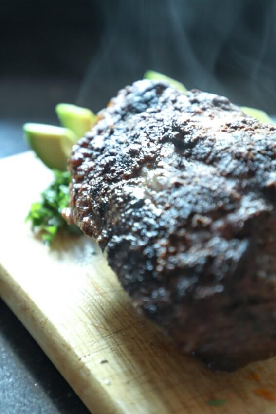 Keto Beef Brisket in the Instant Pot whole on a cutting board with steam