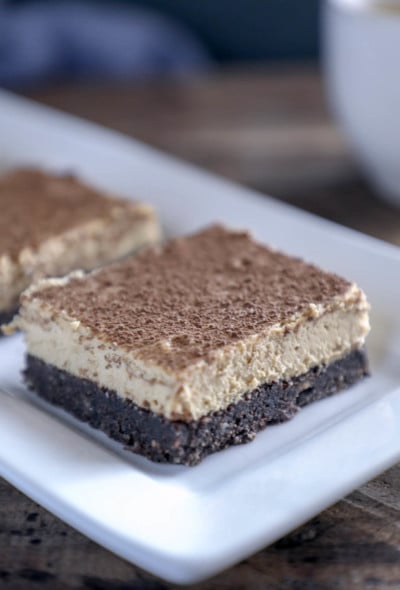 keto espresso cheesecake bars on white rectangular plate