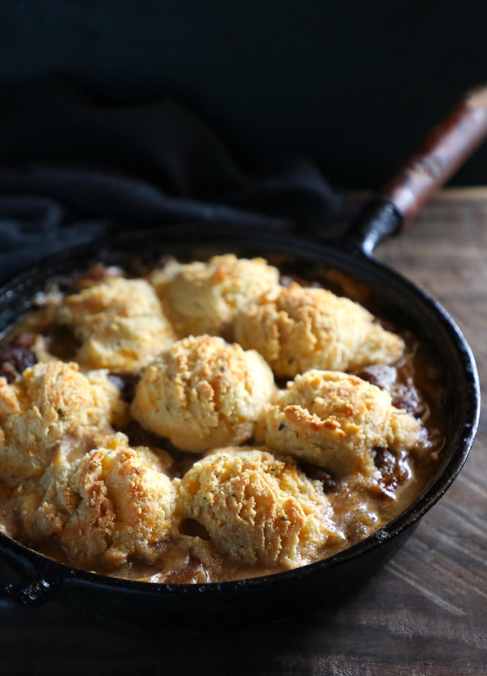 Keto Beef Stew & Cheesy Biscuit Crust in a cast iron pan